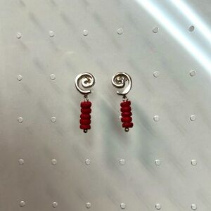 Sterling silver post earrings with curl and red coral dangle.